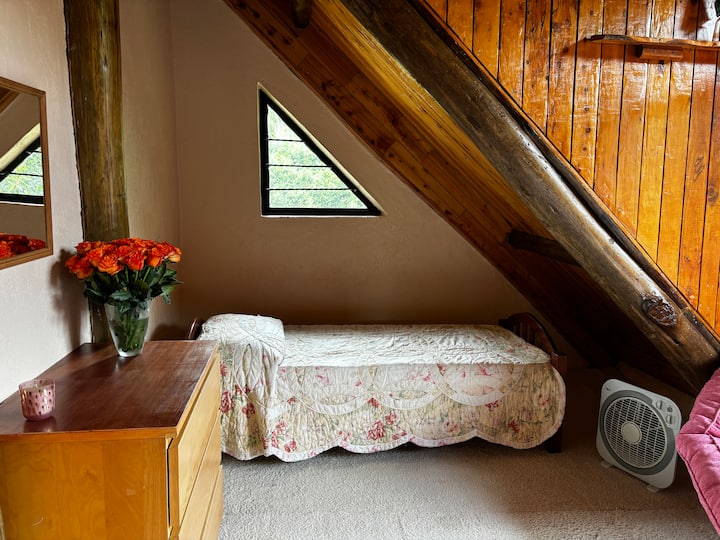 This charming room offers bright, cheerful ambiance along with lovely views of the Malewa River. The cozy twin beds are perfect for children or shorter adults, making it an inviting space for restful nights.