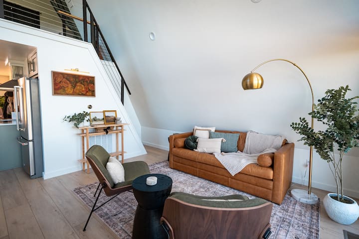 Living Room: Stylish space with warm textures, artistic decor, and a touch of modern charm!