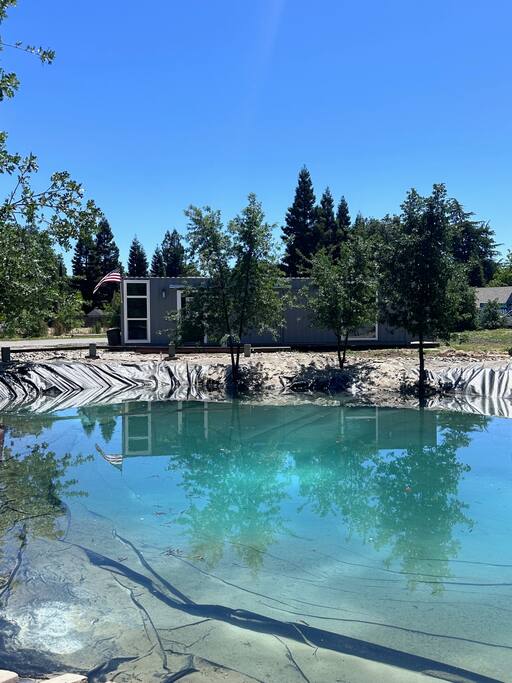 Beautiful Container Home with a Pond & Sand Area