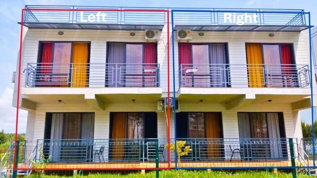 A two-story building with two separate apartments is depicted. Each apartment features a balcony with multiple colorful curtains visible. Large glass doors provide access to the indoor spaces. Lush greenery surrounds the structure, contributing to a bright and airy atmosphere.