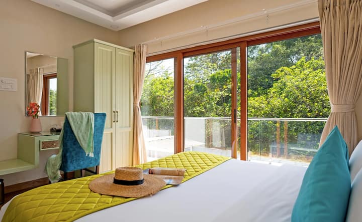 This luxurious, airy bedroom on the first floor seamlessly blends lavish design with minimalist essence. With an ensuite bathroom, this elegant and serene retreat ensures both convenience and relaxation.