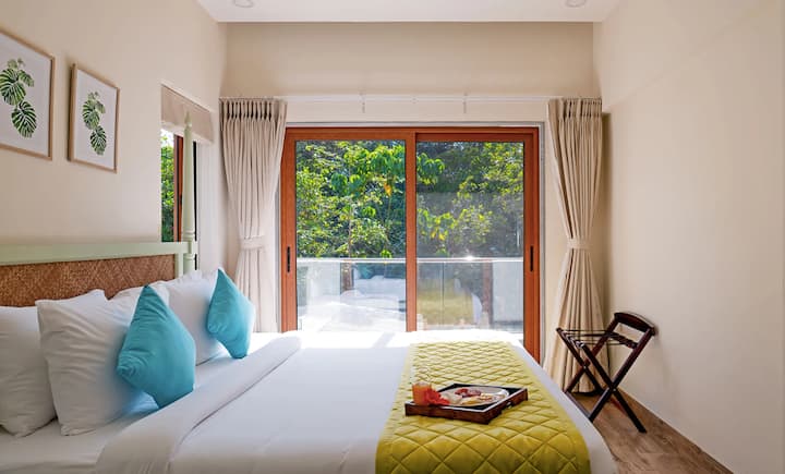 This luxurious, airy bedroom on the first floor seamlessly blends lavish design with minimalist essence. With an ensuite bathroom, this elegant and serene retreat ensures both convenience and relaxation.