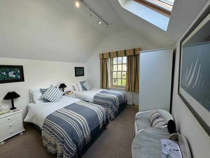 Bedroom Two  made up as a twin room. It can also be made up into a king bed.