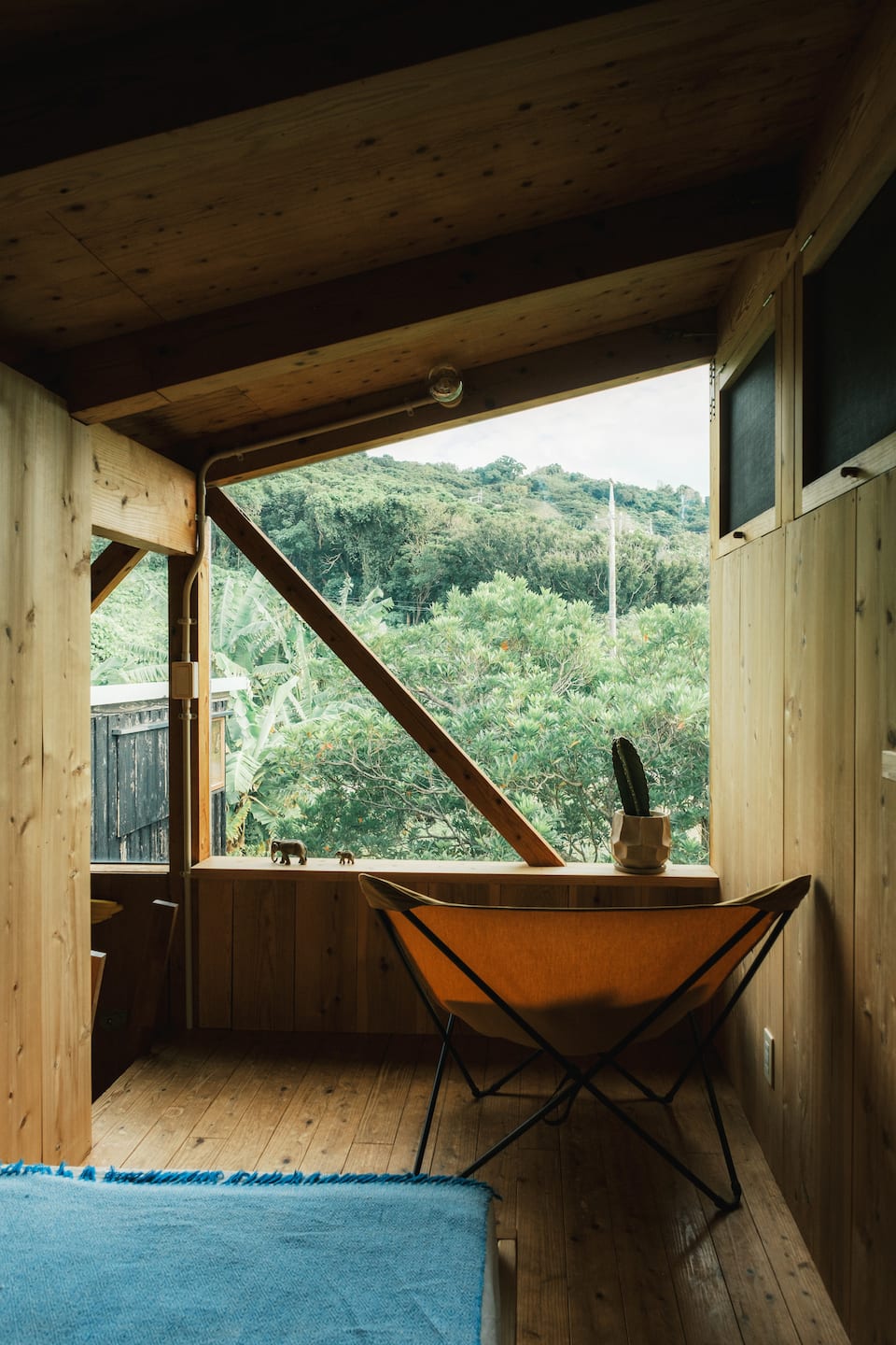 A timber house in a tropical garden in southern Okinawa, Nanjo, Okinawa, Japan, photo 7 of 10