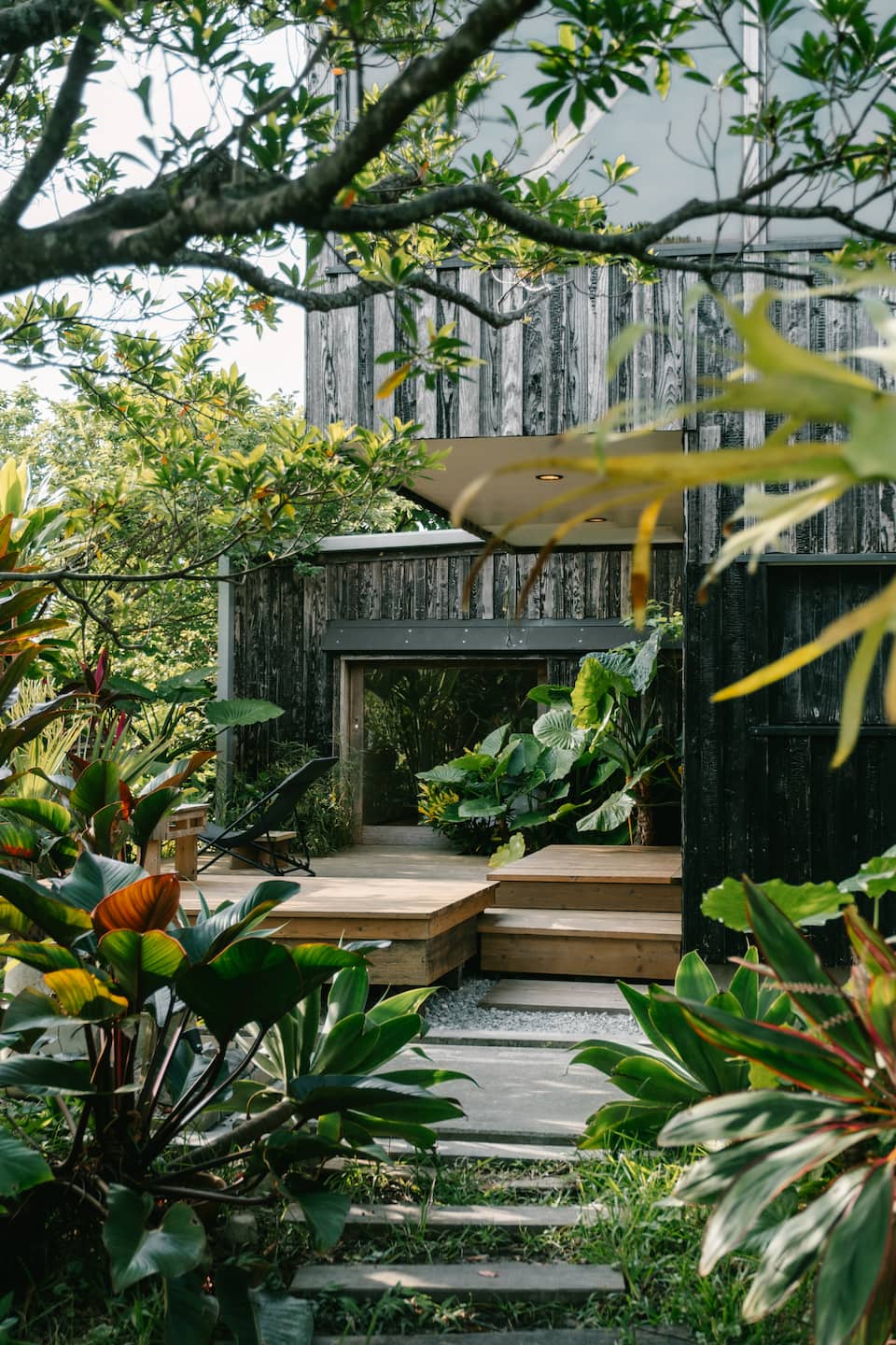 A timber house in a tropical garden in southern Okinawa, Nanjo, Okinawa, Japan, photo 3 of 10