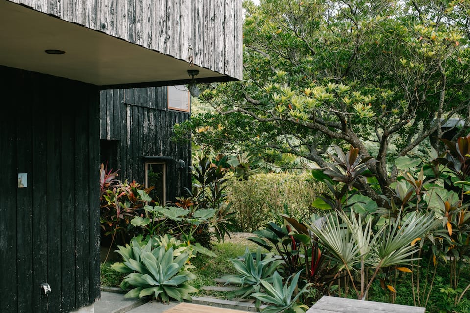 A timber house in a tropical garden in southern Okinawa, Nanjo, Okinawa, Japan, photo 9 of 10