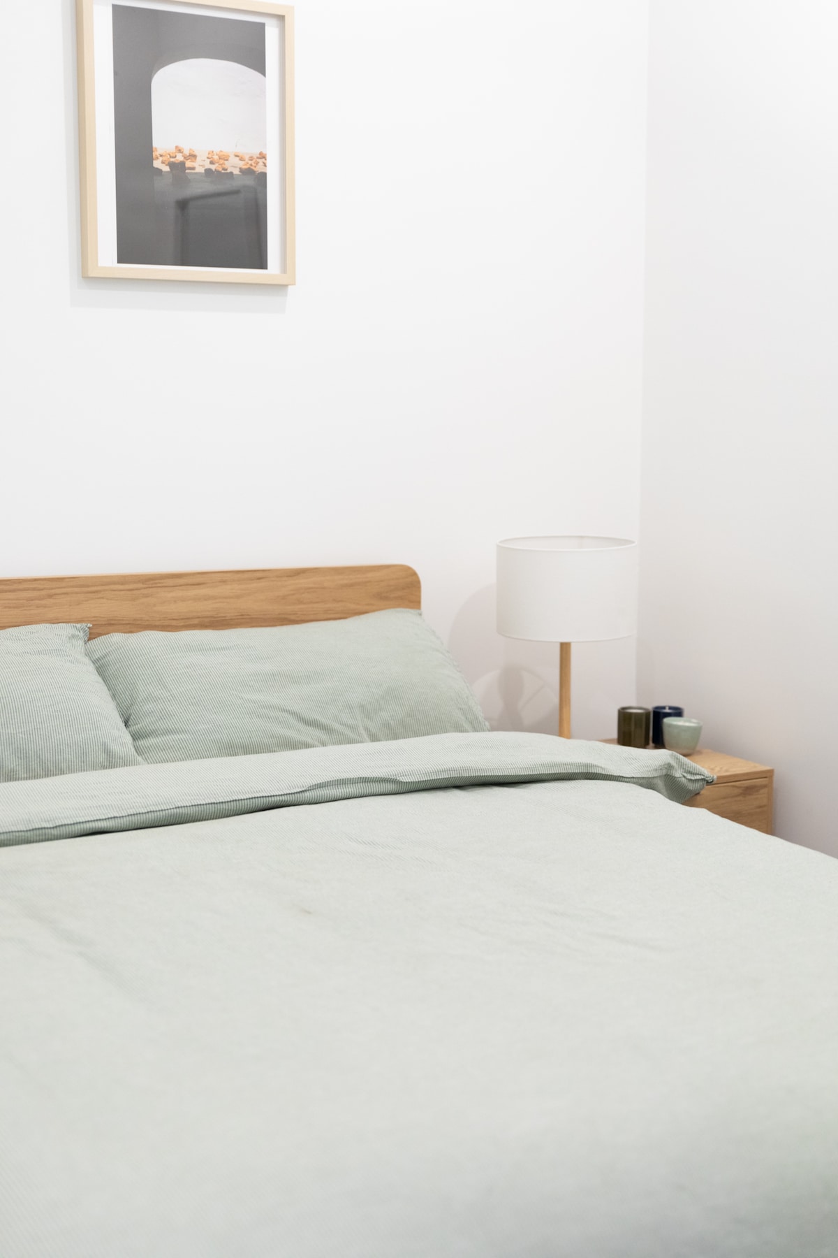 Second bedroom with featuring a cosy double bed and side tables. Built in wardrobe space with sliding door. Fitted with lamps, powerpoints for any charging needs and also a split system air conditioning unit.