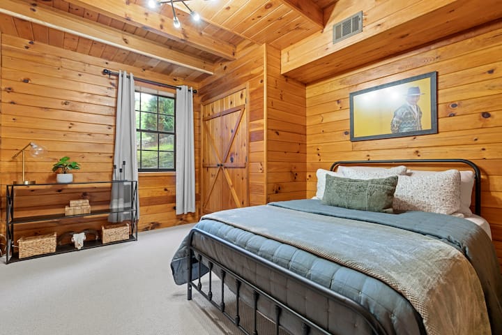The downstairs bedroom features a full-sized bed, closet, and clothing storage. 