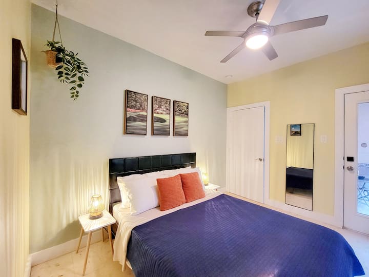1st Floor - Guest Bedroom:  Queen size bed with en suite full bathroom and door to backyard