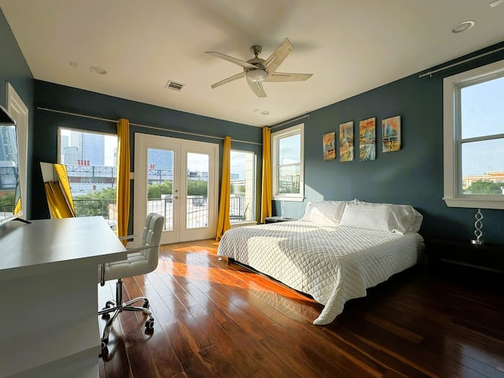 3rd Floor - Master Bedroom:  King bed with 2 pull out twin mattress beds.   Full workspace desk and chair.  Large Smart TV.  Spacious walk-in closet.  Private Balcony with views of downtown and the George R. Brown Convention Center.