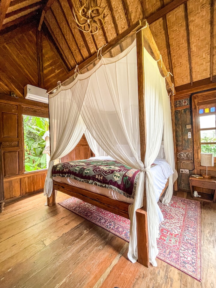 Bright and airy bedroom with king sized bed with natural light