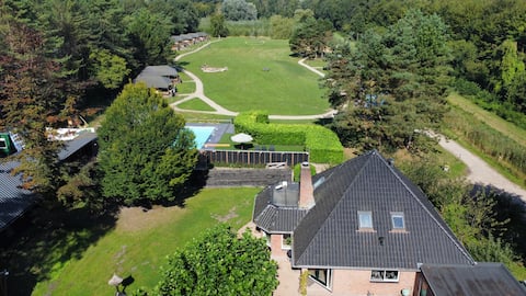 Villa with sleeping lodge and swimming pool.
