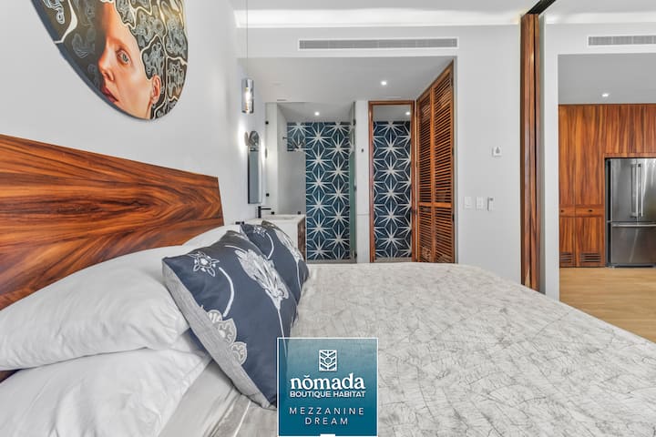 Custom designed king bed in exotic Parota wood  is very comfortable for a great night sleep. It also has storage on both sides plus night stands. Auto roller shades offer privacy during the day, and auto blackout curtains are perfect for sleeping.