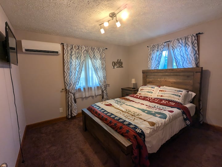 A view of one of the rear bedrooms in the upstairs section of the home