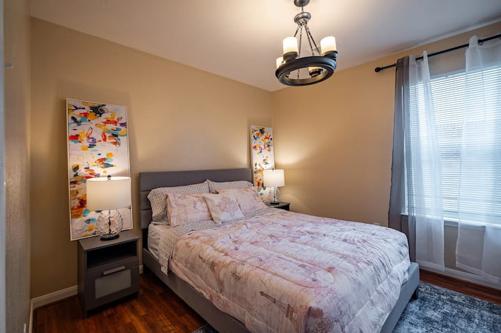 Another bedroom with queen size bed, and big screen TV.