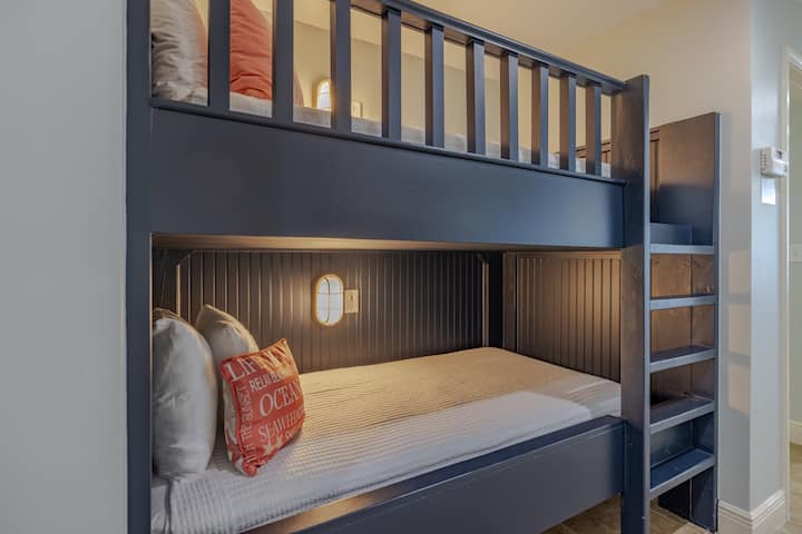 Sleep up to two people in this new custom-built twin over twin bunk bed. Each bunk has its own built in light for reading or just hanging out!