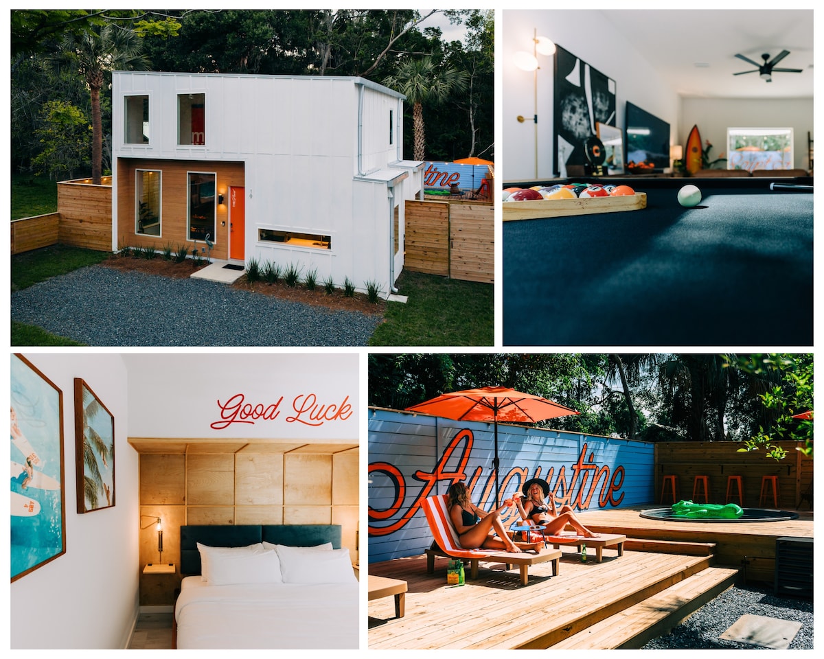The exterior showcases a modern two-story home with large windows and a vibrant "Good Luck" sign. The living room features a billiards table and surfboard decor, while the bedroom contains a minimalist design with a spacious bed. An outdoor sun deck is visible, with lounge chairs and umbrellas.