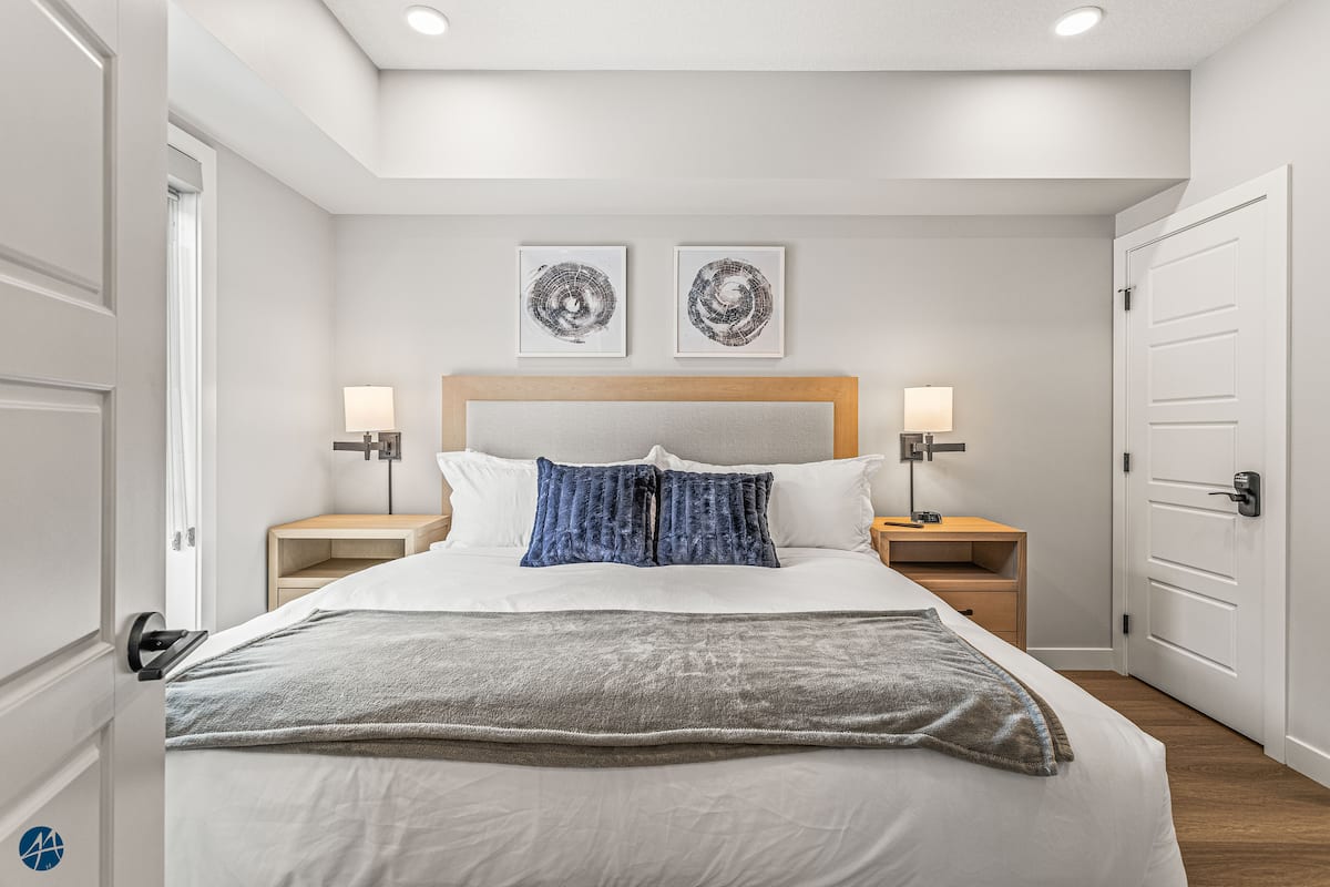 Primary king bedroom with ensuite bathroom at Dead Man's Flats Airbnb
