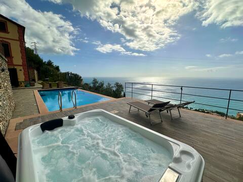 Heated hot tub, swimming pool and sea view