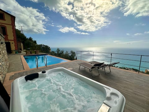 Heated hot tub, swimming pool and sea view