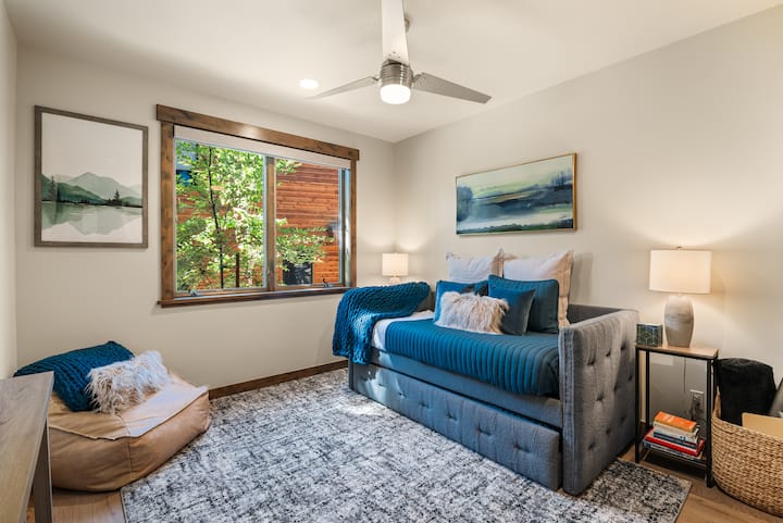This cozy downstairs room features a twin daybed with a pull-out trundle—perfect for kids, teens, or extra guests in your group.