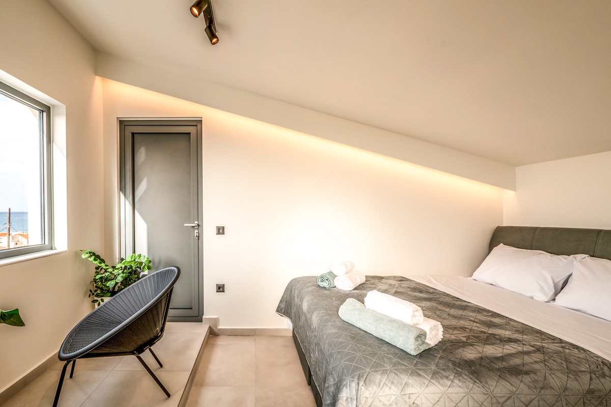 Attic Level: Bedroom with private balcony