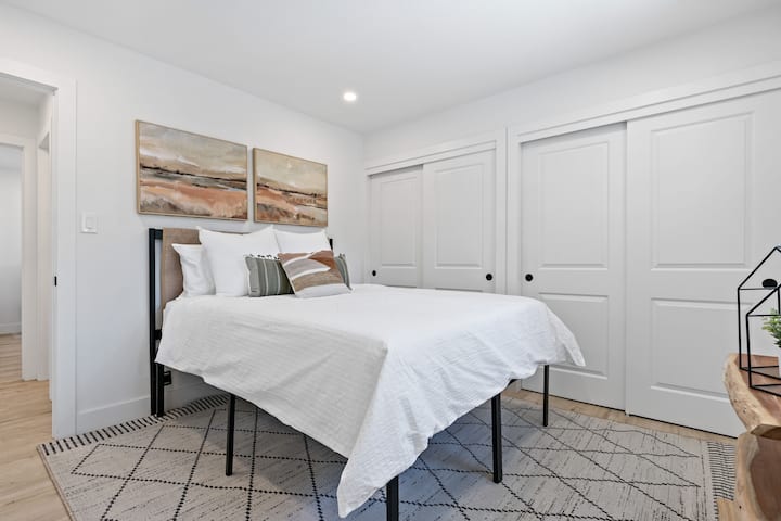 Main level bedroom features queen size bed that can comfortably sleep two people.