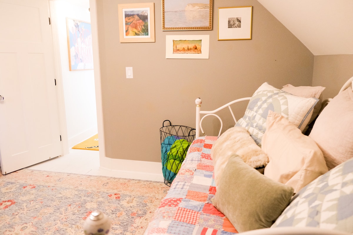 The second bedroom features a trundle day bed, seating area, and kitchenette. 