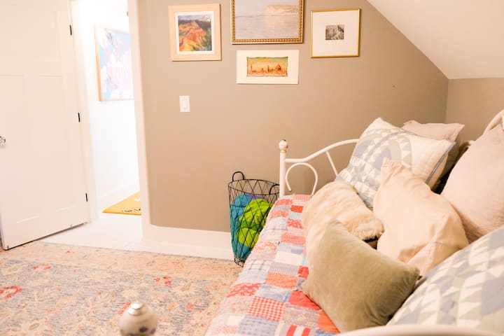The second bedroom features a trundle day bed, seating area, and kitchenette. 