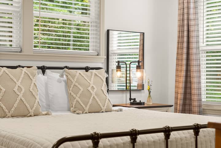 The primary bedroom named "The Estate Reserve"- Sleep soundly on the king sized bed. Located on the main level. 