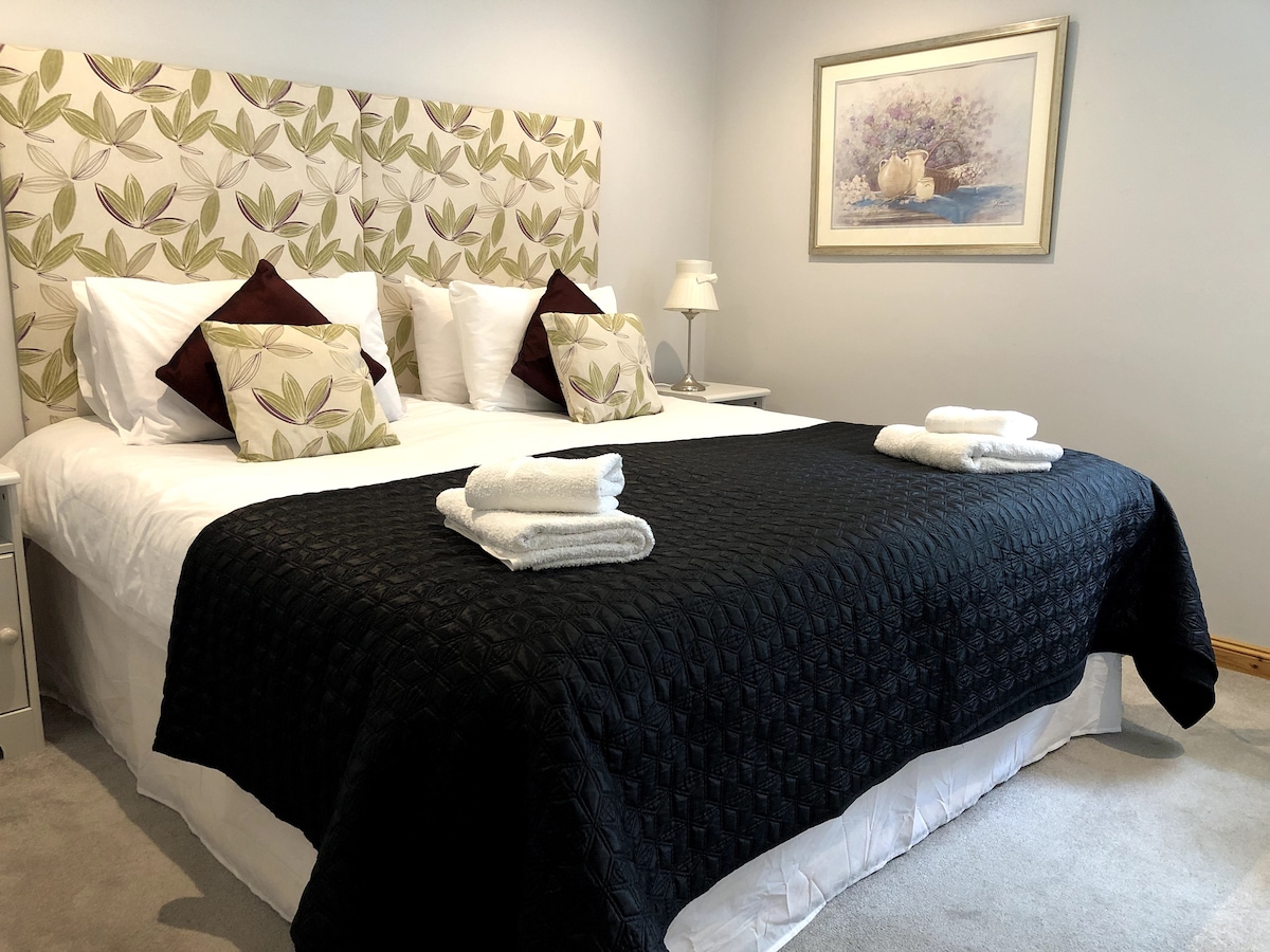 Second bedroom with super king-sized bed.