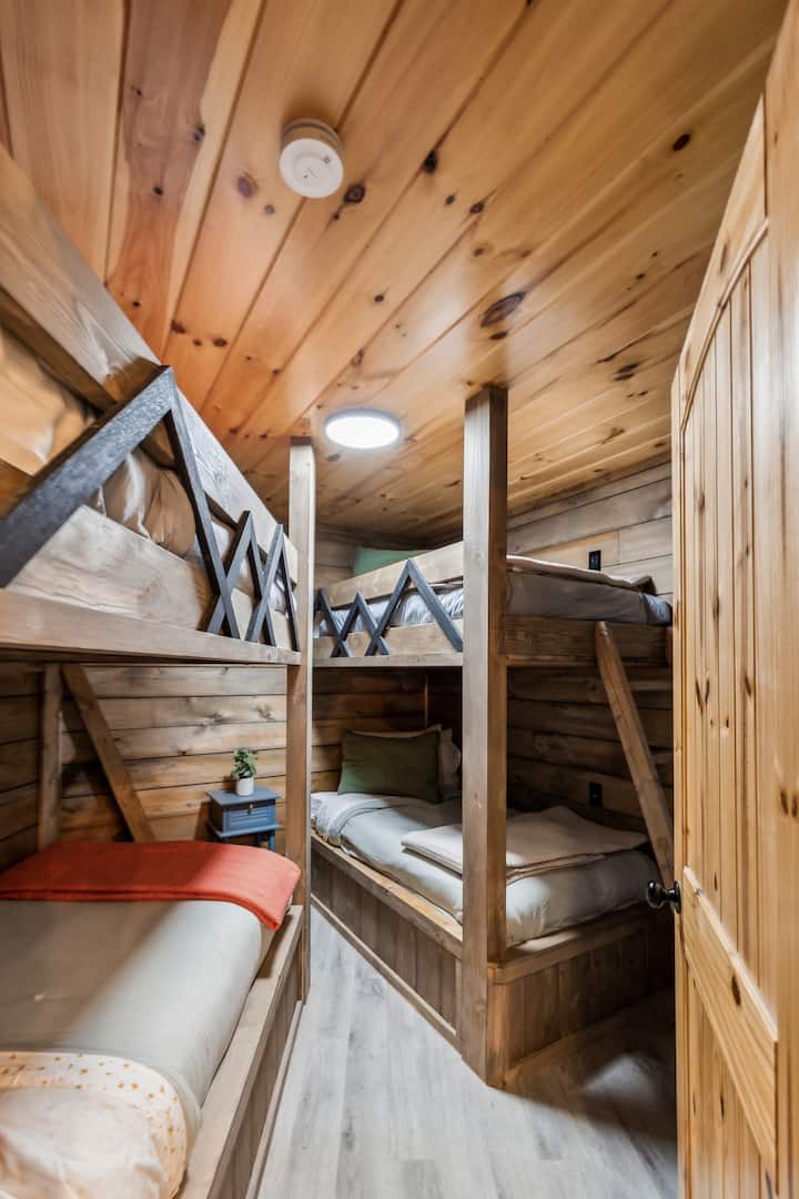 Bunk Room: Adventure awaits in this charming multi-bunk retreat, perfect for family fun!