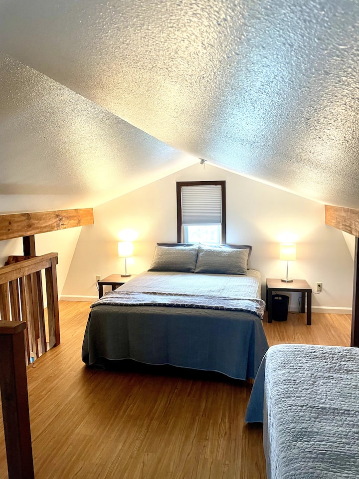 Queen bed is upstairs along with 2 twin beds in the same room