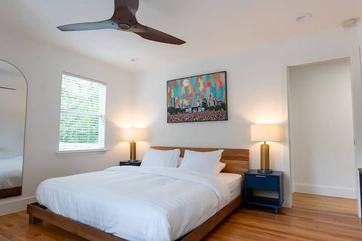 This king-sized bed lets you unwind in comfort and style! Austin City Limits artwork from local Austin artist Jake Bryer. 