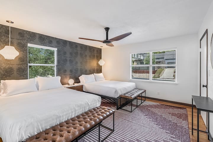 Crisp, clean comfort with dual queens with luxury bedding to help you catch some Zzz's.