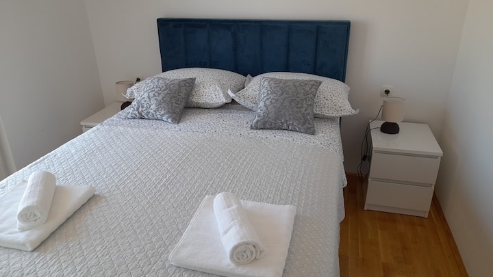 Blue bedroom with a double bed, perfect for kids or friends.