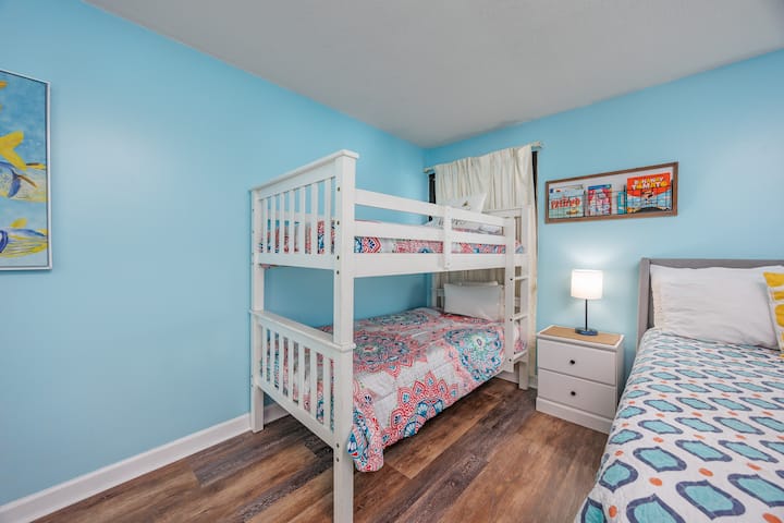 Second bedroom features a queen bed and a bunk bed perfect for when you travel with kids