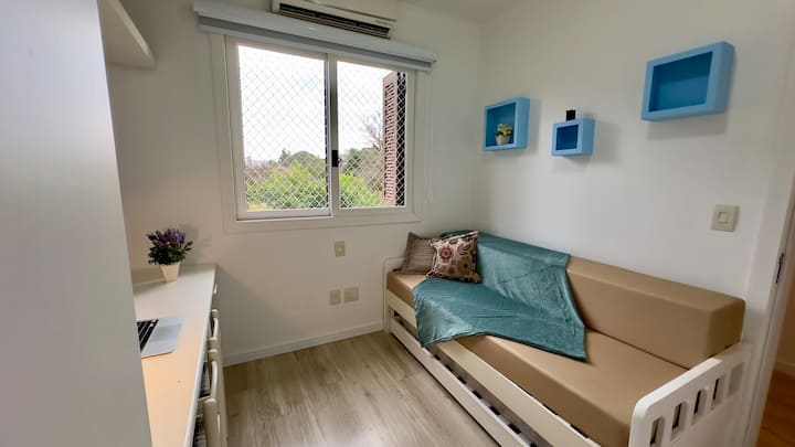 Room with double sofa, air-conditioning (Hot/Cold) and Home office space. 