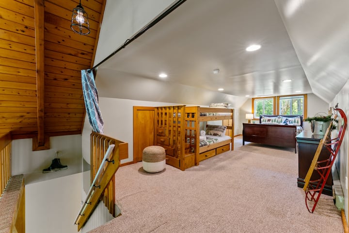 The spacious loft, offering beautiful scenic views, serves as the third bedroom! Please note, this area is closed off with curtains, not a door.