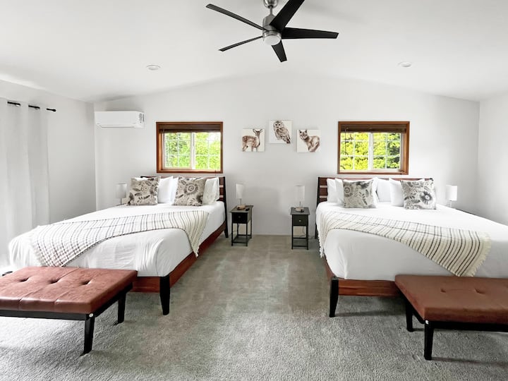 Comfy-cozy King and Queen beds with cotton linens and two different firmness of pillows for your choosing.  Smart TV, nightstands with USB and USB-c charging, and this main suite located upstairs has its own AC, overhead fan and private bathroom.