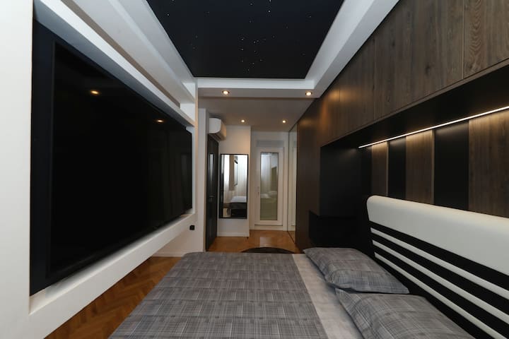 Legacy Marine 3 - Serenity, master bedroom, 65"tv with Youtube/netfix, sat/tv, fiber optic star sky, ambience led lighting, leather designer super king bed with built in Led light, air conditioning, electric smart curtains...