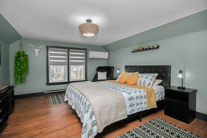 The Lake Huron Room, located up to the left, offers personalized climate control with a split-unit AC and heat, along with electric floorboard heating for extra warmth and comfort during year-round.