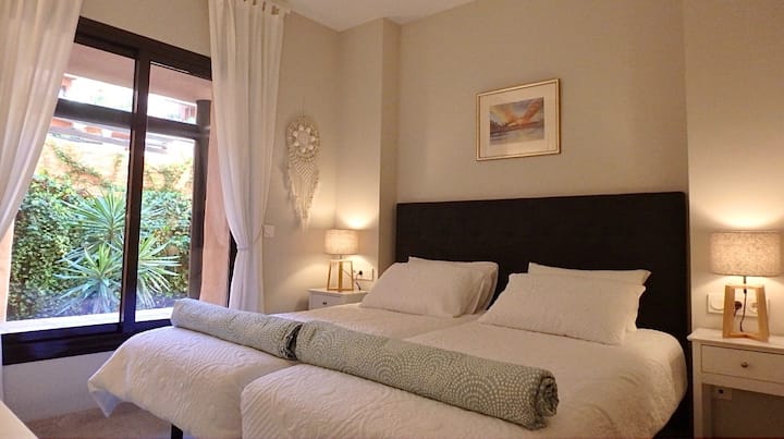 Bedroom 2, next to guest bathroom. Incudes twin single beds, which can be easily separated, dressing table/desk, double wardrobe, electric black out shutter blinds and hot and cold  air conditioning.