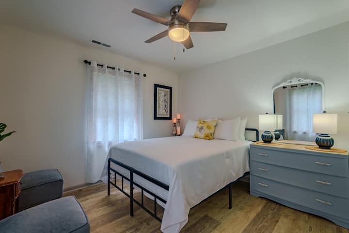 2nd bedroom features a queen sized bed with a sitting area and plenty of storage for your stay