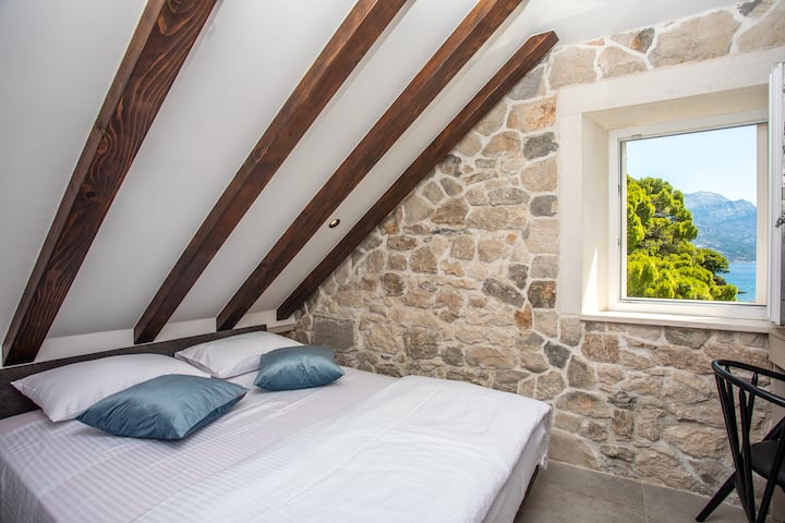 Cozy queen bedroom with a breathtaking view, perfect for relaxing mornings and tranquil evenings.