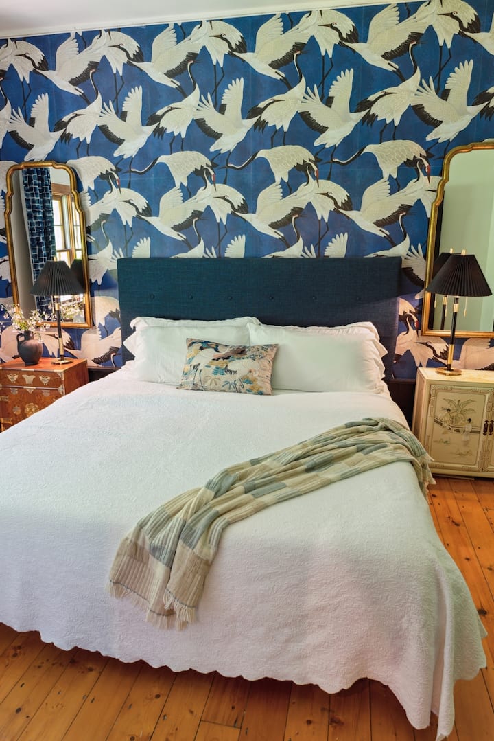 On the first floor, this bedroom has an Asian barn vibe. 