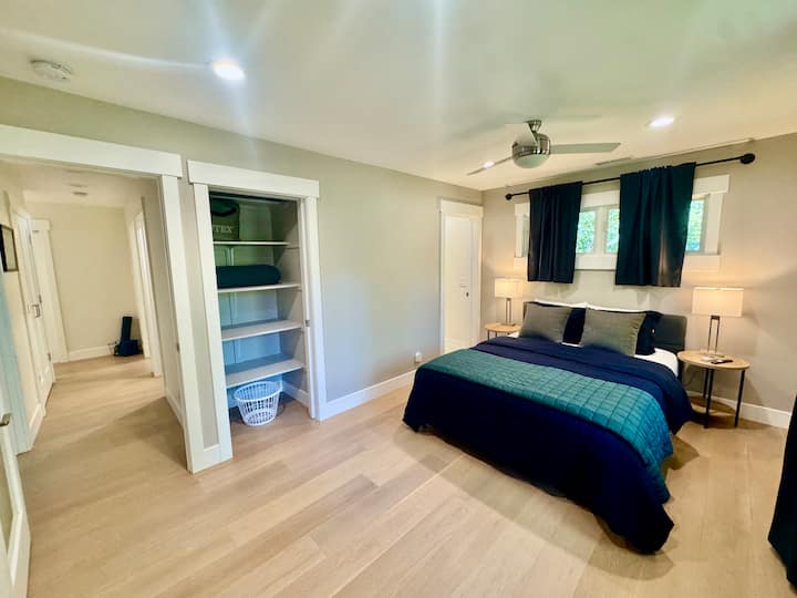 Comfortable bedroom with ample storage. This relaxing bedroom features a cozy bed, bedside lighting, and closet space for storing your belongings during your stay.