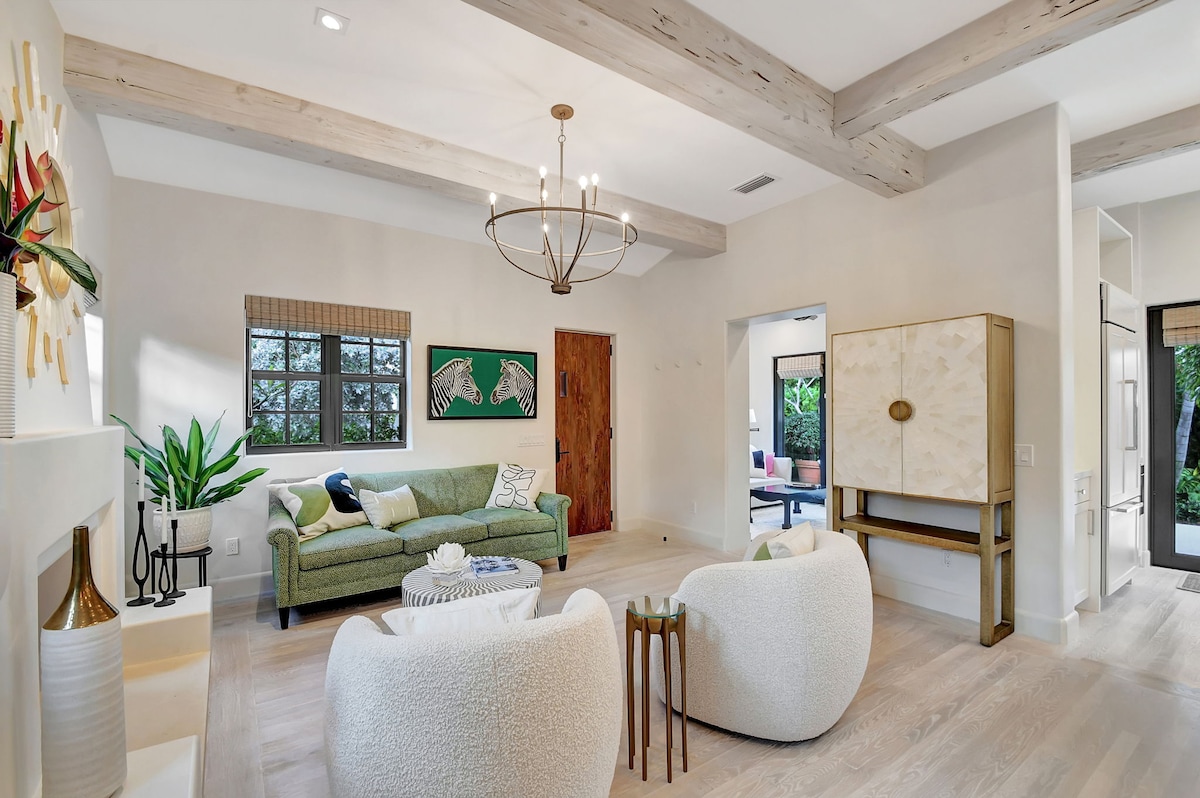The bar cabinet features wine glasses, an ice bucket, a shaker, and more.