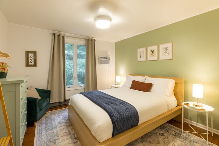 This inviting bedroom offers a restful retreat with elegant decor and a cozy queen-sized bed.