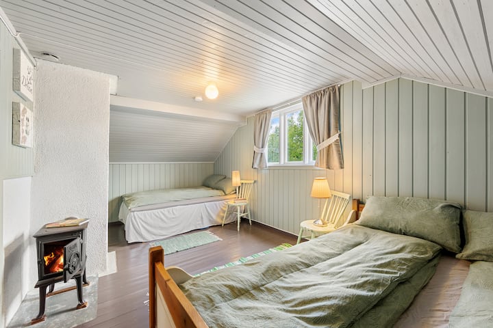 Two large, comfortable double beds. View right onto the creek.